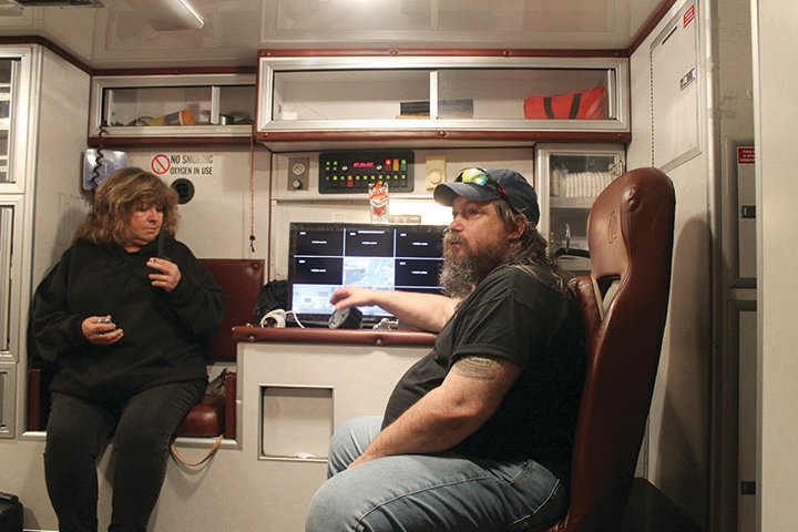 Jones and Akin discuss the next steps in the investigation from inside the Central Michigan Paranormal Investigations command center, a retro-fitted 2006 ambulance.