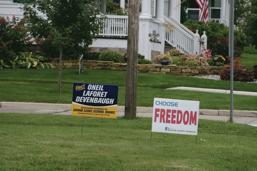 A political yard sign supporting three conservative candidates for Grand Ledge Public Schools Board of Education as well as a sign from the Eaton County Patriots group.  