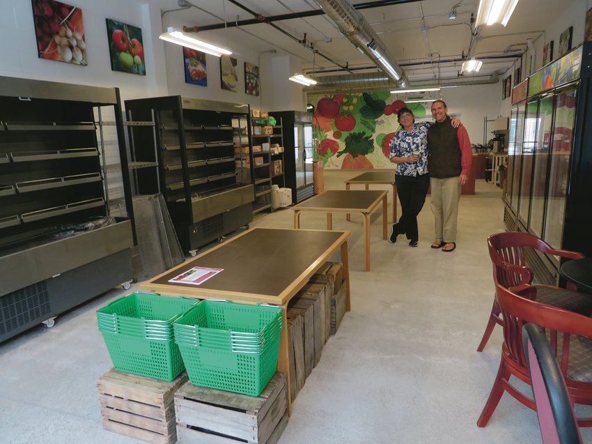 Sally Potter and ELFCO bookkeeper M.C. Rothhorn promenade through the “south room” facing Kalamazoo Street where local produce, baked goods, coffee and prepared foods will be sold and consumed. 