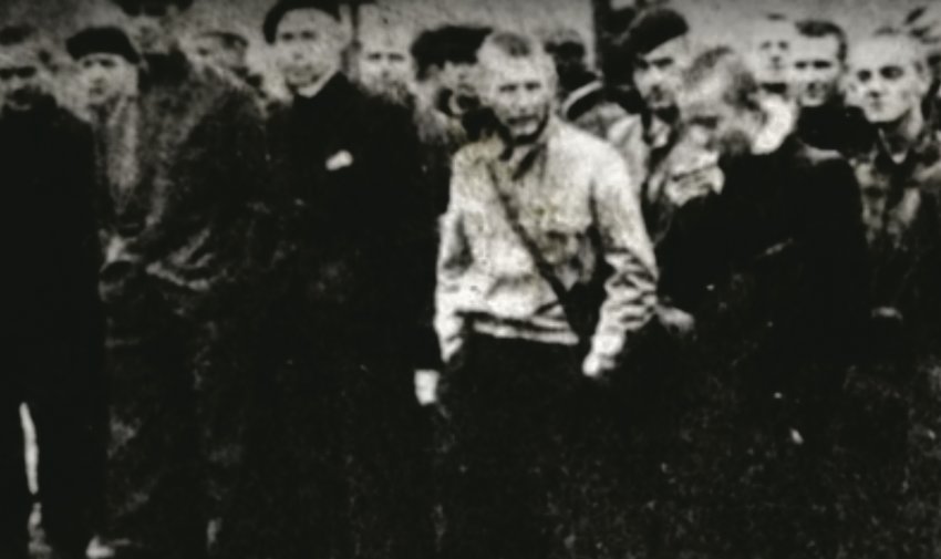 The only known photo of Hilding and other captured Allied airmen at Buchenwald concentration camp. Hilding is fifth from left, in black beret. The man standing third from left, slightly taller than Hilding and almost touching his shoulder, is Raymond Wojnicz, the bombardier on Hilding’s B-17. 