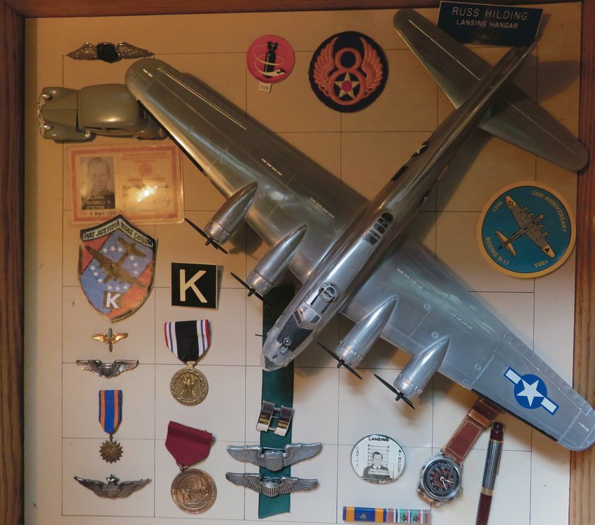 A memorabilia case in the Delta Township home of Russell Hilding, one of the Buchenwald Airmen of World War II. 