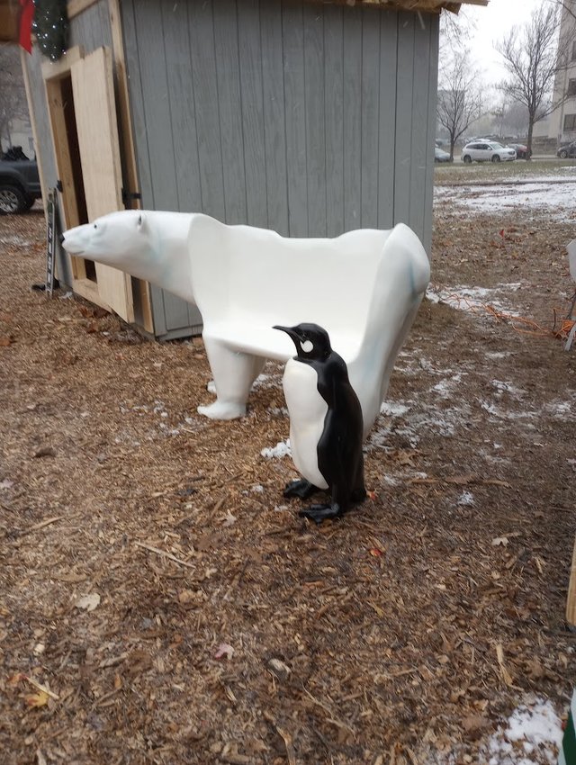 A polar bear bench and a giant penguin will watch as guests skate in the Reutter Park artificial ice rink or visit the Kringle Holiday Market in downtown Lansing.