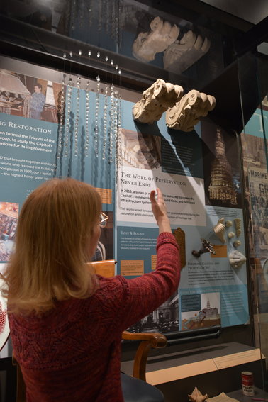 Two of the actual modillions are on display so visitors can get a close-up look at some of the roofline’s architectural embellishments. Nearby is one of the original window frames from the Capitol dome, which was salvaged during an earlier project.  