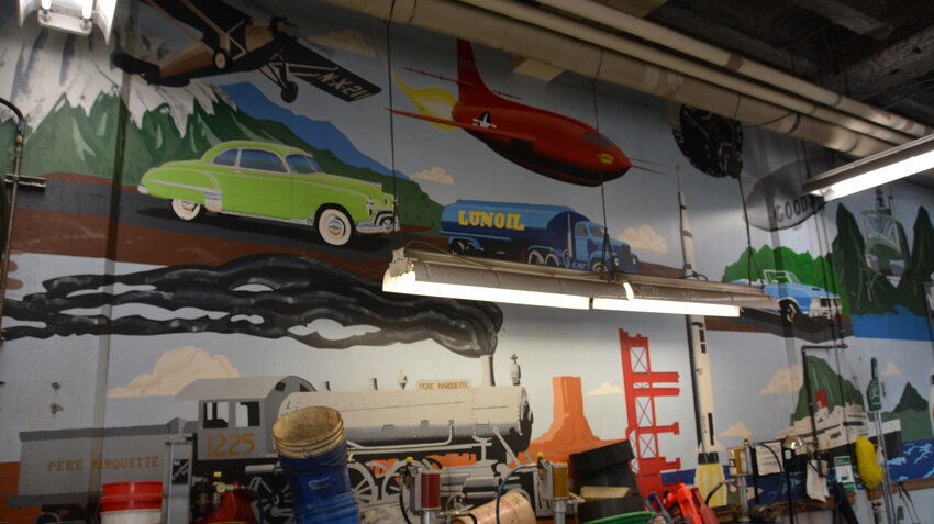 A mural at Michigan State University’s service garage under Spartan Stadium depicts transportation throughout the ages.