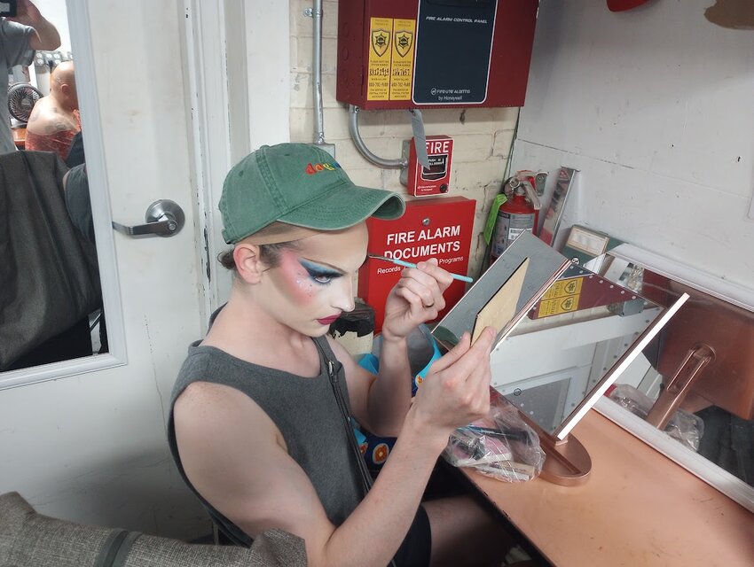 Nick Fuller puts the finishing touches on his make-up in preparation for a Drag Brunch performance in Royal Oak June 4. His drag persona is Jewel Jubilee.