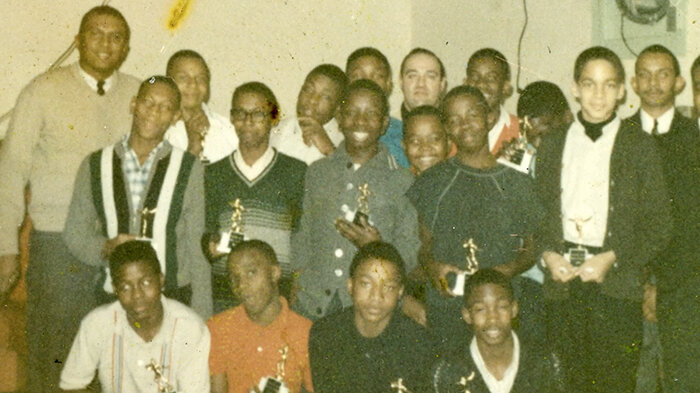Courtesy photo
Pop Warner football games were wildly popular in the neighborhood. Party store owner Frank Spagnuolo (center, back row) was threatened with arson for sponsoring an all-Black team. Developer and former MSU Trustee Joel Ferguson (far left) coached the team.