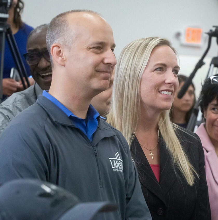 Photo by Roxanne Frith
Lansing Mayor Andy Schor and Ingham County Clerk Barb Byrum, who both considered running for the 7th Congressional District nomination, look on as Hertel announces his candidacy.