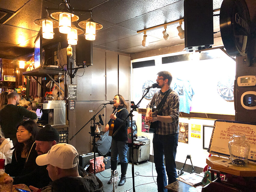 Two members of the Dangling Participles, a Lansing-based “jazzy indie-folk band,” play an acoustic set at the Peanut Barrel, booked by Angry Talent Entertainment.