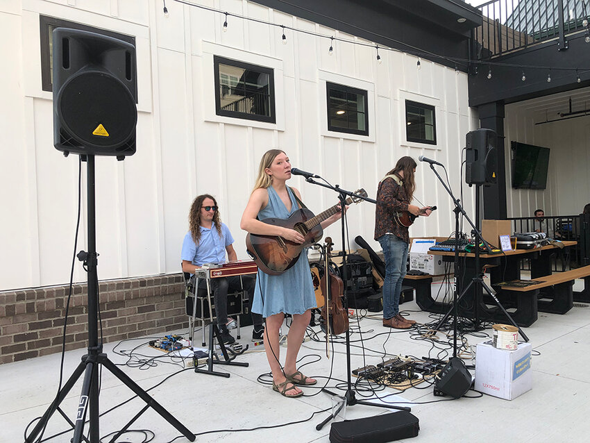 A trio of members from the Wild Honey Collective, a Lansing-based folk and roots group, perform at the Old Bag of Nails Pub, booked by Angry Talent Entertainment.