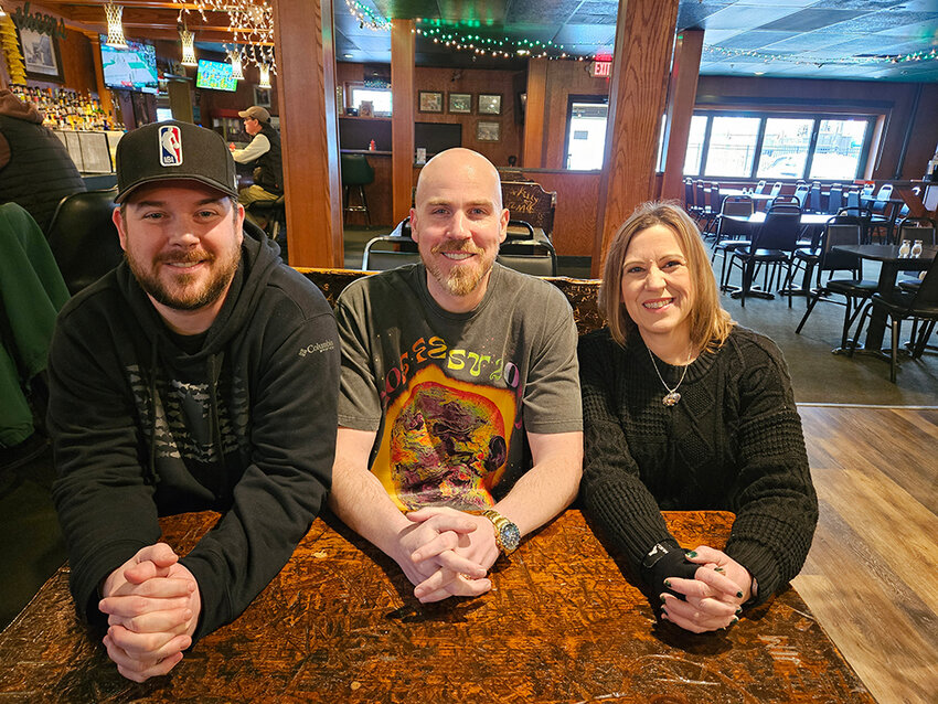 From left: “Salamander” assistant director Andy North; director, writer and co-star Paul Rothman; and producer Keli Williams Johnson set up shop at a booth at the Mayfair Bar to discuss the film, which screens 8:45 p.m. Saturday at Studio C! in Okemos.