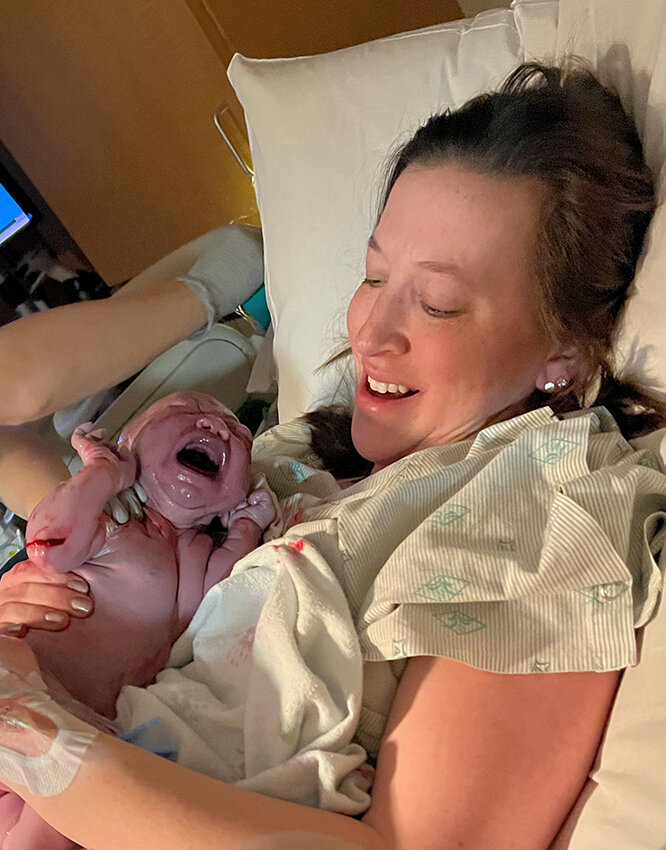 Once her daughter’s head and shoulders had been born, Kendra Ouillette lifted the baby onto her chest for some skin-to-skin contact, which helps with an infant’s ability to regulate temperature and blood sugar and decreases stress for both the parent and baby.