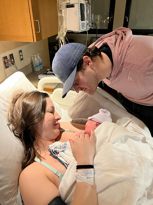Kendra Ouillette and Matt Theiss spend the first hours after the birth of baby Bennett gazing at her in the labor and delivery unit  before moving to a recovery room.