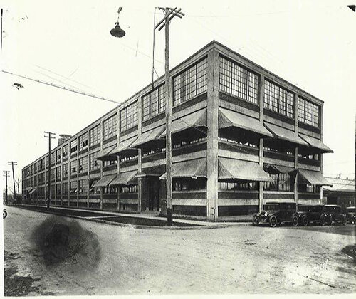 Historical photo circa 1926 showing awnings and a peek of original office window configuration.