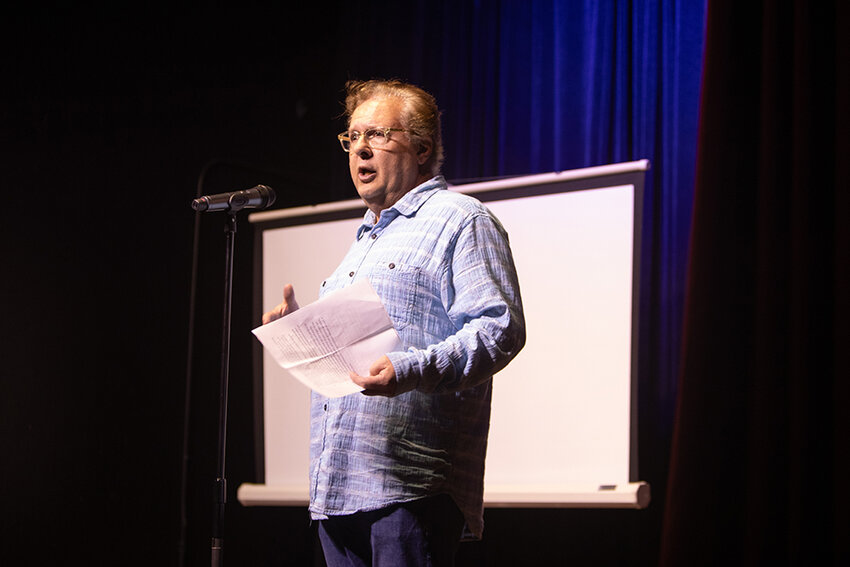 Bob Trezise Jr., president and CEO of Lansing Economic Area Partnership, which initiated and operates the Lansing poet laureate program, at the Robin Theatre event.