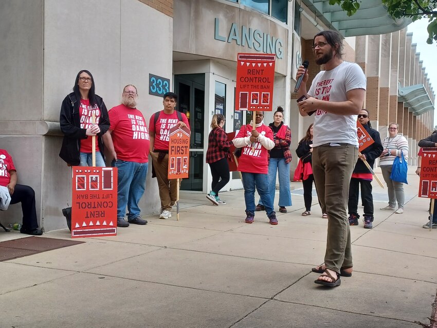 William Lawrence, state coordinator for the Rent Is Too Damn High renter’s advocacy coalition, offers his closing remarks near the end of a May 14 rally outside of the Lansing Center. 