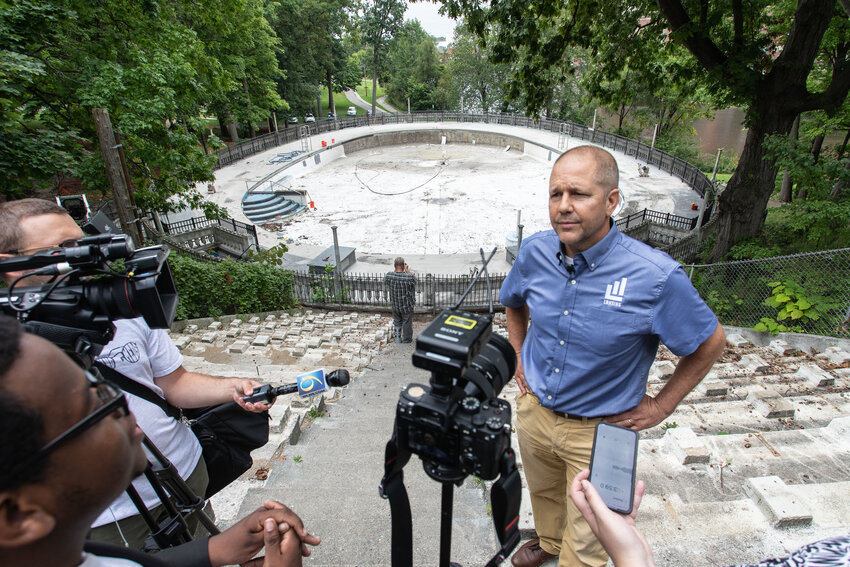 Lansing Parks and Recreation Director Brett Kaschinske speaks to the media on the renovation timeline for Moores Park Pool.