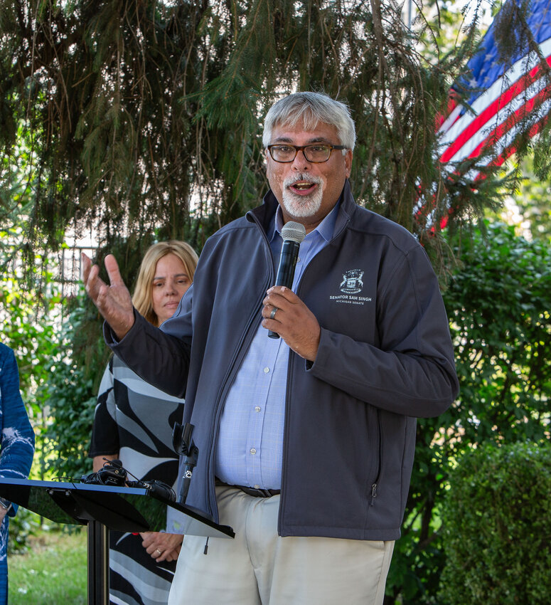 State Sen. Sam Singh celebrates the growth of green energy initiatives in East Lansing.