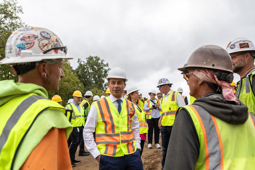 Buttigieg chats with union workers in East Lansing.