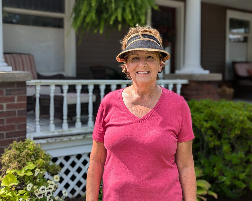 Retiree Christine Powers, outside her Charlotte home, backs Democrat Curtis Hertel Jr. for the U.S. House seat.