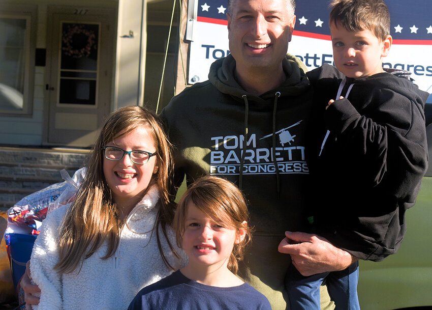 Dawn Parker for City Pulse
Barrett and his daughters (left) Eleanora, 10, and Gwendolyn, 7, and  son Louis, 3, in his arms.