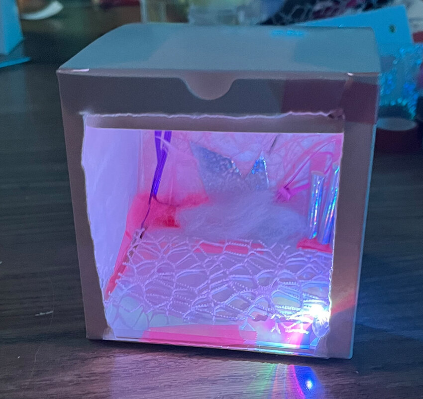 Photo by Amber Crosby-Boerma
Inspired by Mohamoud’s “Complex Dreams,” Holt Junior High School students made intricate “illuminated environments” at a workshop with interns last fall.