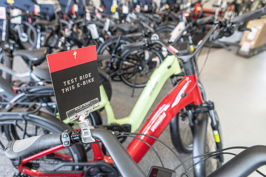 Denny’s Central Park Bicycles in Okemos encourages test rides on e-bikes.