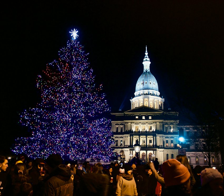 A crowd gathers around the state Christmas tree in front of the Capitol during the annual Silver Bells in the City celebration.