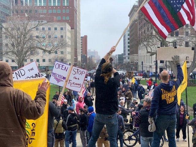 Hundreds of beeping vehicles swarmed downtown Lansing yesterday, jamming up several intersections, blocking roadways and crowding the State Capitol lawn to protest Gov. Gretchen Whitmer&rsquo;s &ldquo;Stay Safe, Stay Home&rdquo; executive order.