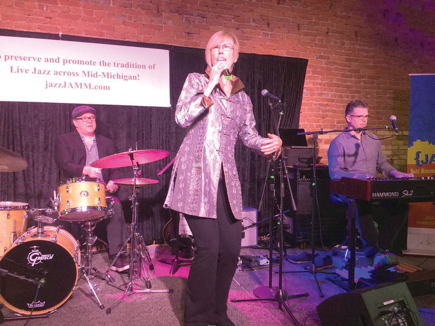 Drummer Jeff Shoup, vocalist Sunny Wilkinson and organist Jim Alfredson perform at an all-star concert at Lansing&rsquo;s Urban Beat last Nov. 11. The concert will be streamed at a watch party Friday to celebrate International Jazz Day.