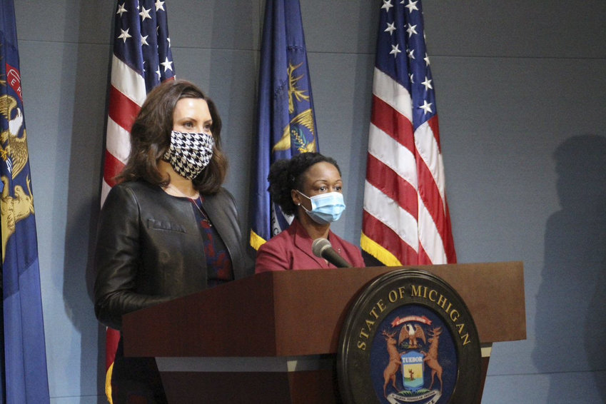 Gov. Gretchen Whitmer and Dr. Joneigh S. Khaldun, the state's chief medical executive, donned masks at the governor's coronavirus media briefing Thursday.