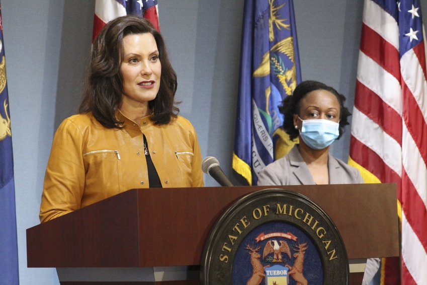 Gov. Gretchen Whitmer, with Dr. Joneigh Khaldun, the state's chief medical executive, announcing that manufacturing can reopen Monday.
