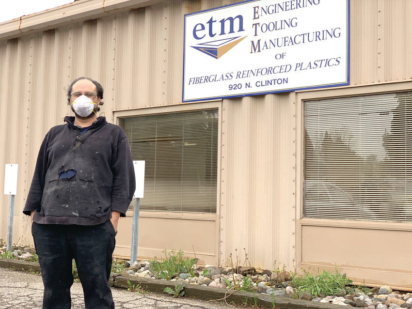 Rick Luna outside his workplace in Grand Ledge, where he worries about his safety because coworkers are not all wearing masks and keeping a six-foot distance.