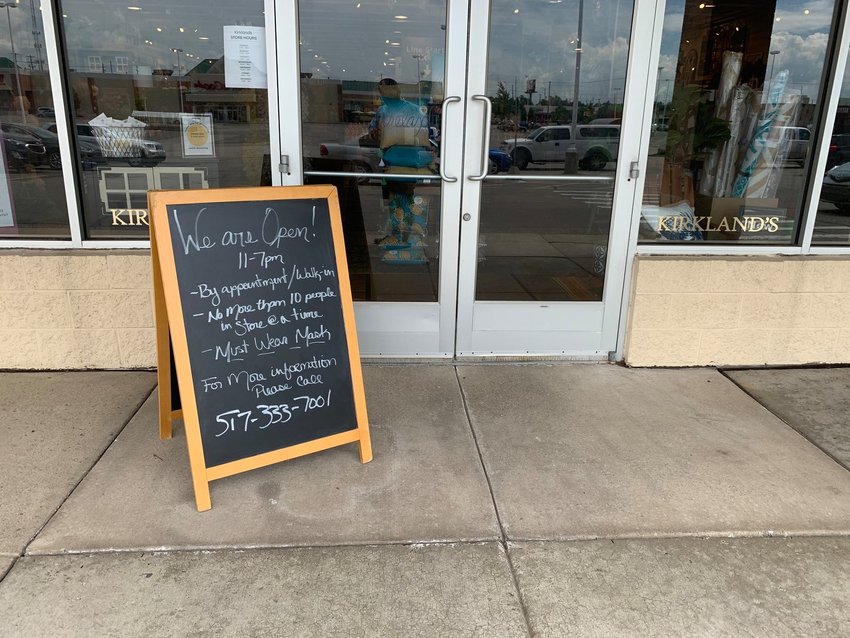 A sign outside Kirkland's home decor store in Frandor spells out the rules for customers.
