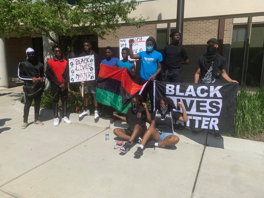 Protesters in front of City Hall in East Lansing this year.