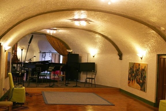 The third floor of the Potter House is a glittering stucco ballroom used as a concert hall and recording studio by co-owner Sergei Kvitko.