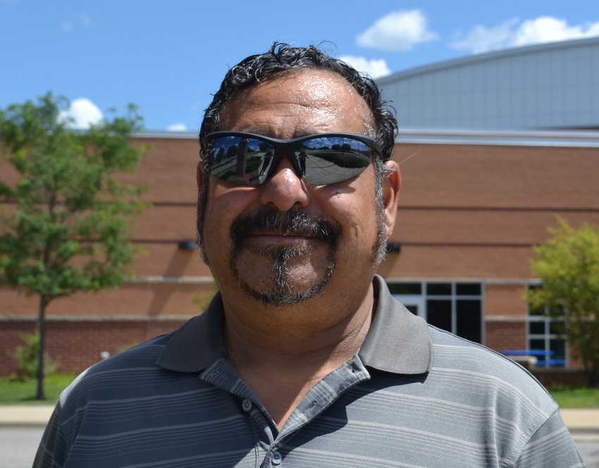 Bob Pe&ntilde;a, who won the Democratic nomination to the Ingham County Board of Commissioners from the east side, in front of Eastern High School.