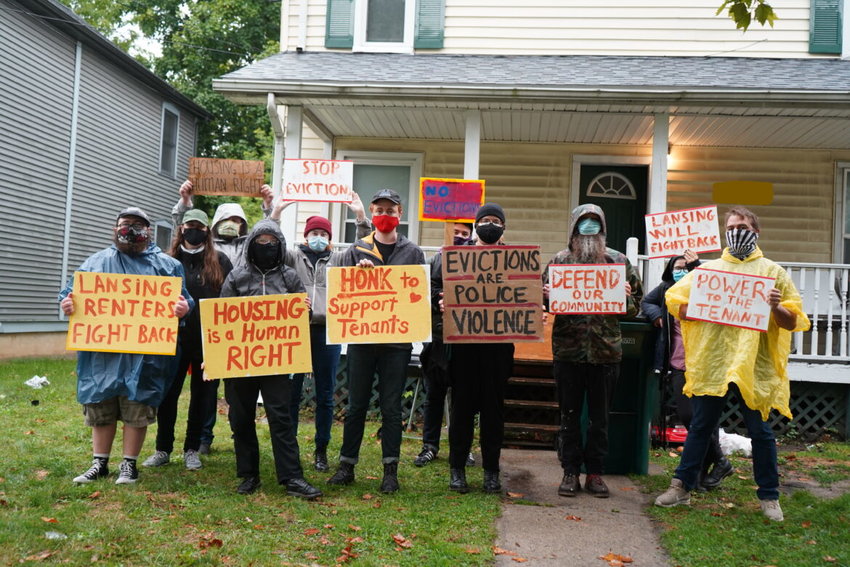 Volunteers from the Lansing Tenant Union protest recently in front of a Lansing house where a tenant is at risk of eviction. Some tenants do not qualify for protection under an eviction ban issued by the Centers for Disease Control and Prevention