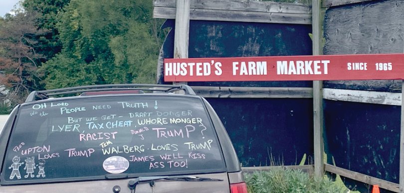 A vehicle in front of Husted&rsquo;s Farm Market, 9191 W. Main St., in Kalamazoo, warns shoppers of the dangers of a Donald Trump presidency.