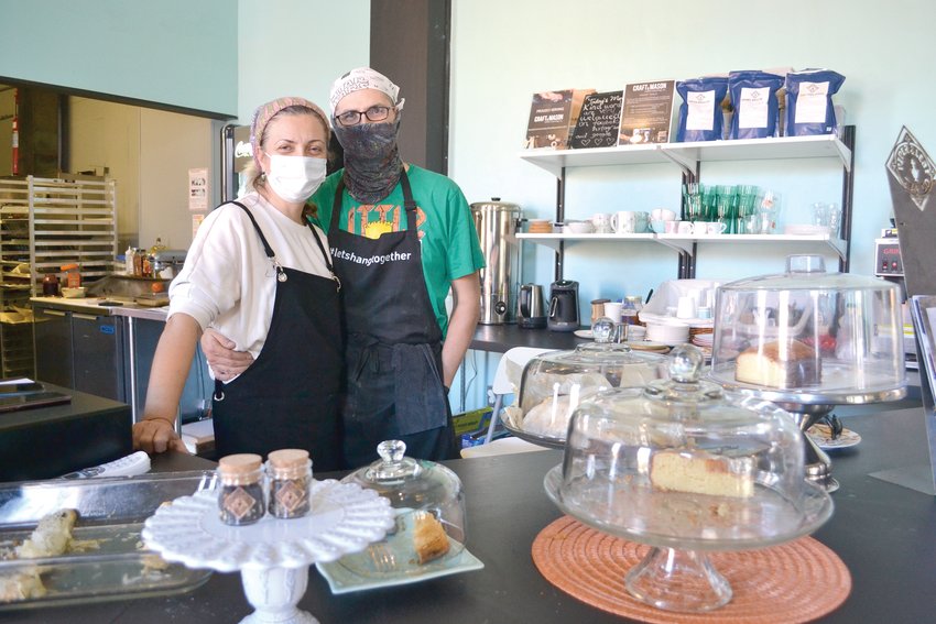 Burcay (left) and Aybars Gunguler, owners of Social Sloth Cafe &amp; Bakery, which has received a lot of support through social media campaigns such as   #LiftUpLocal
