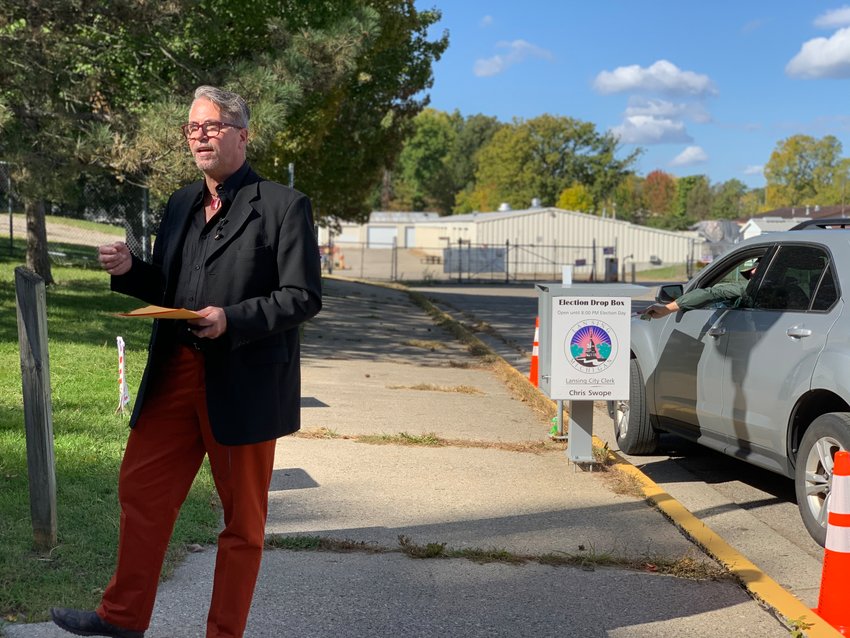 Lansing City Clerk Chris Swope near the ballot drop box outside the old Washington Avenue armory as he counters an allegation by the Michigan Republican Party that such a box had been compromised.
