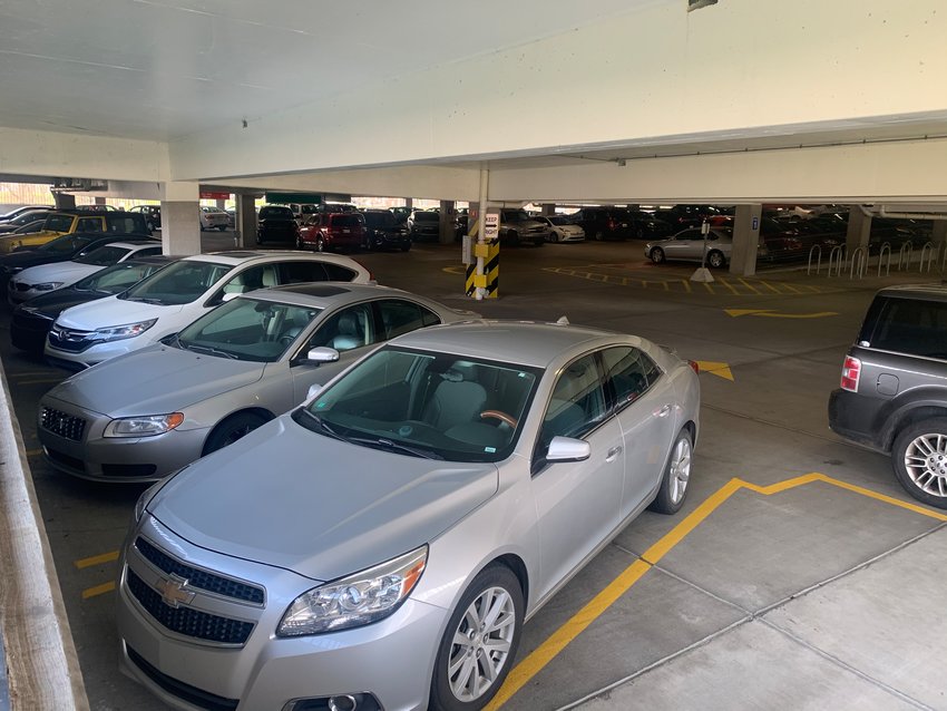 Cars parked in the ramp of the Accident Fund Insurance Co. of America, where some employees complain they are being forced to work in the office unnecessarily during the pandemic.