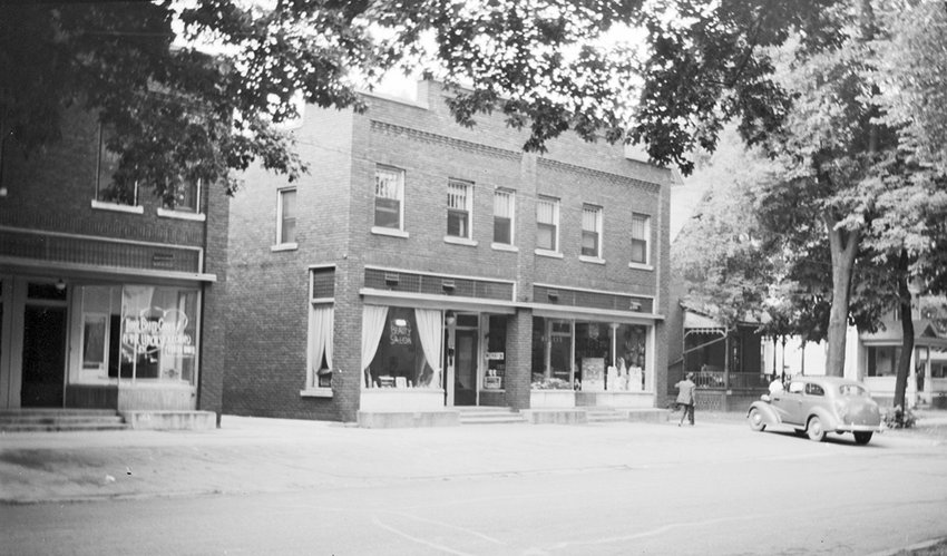 A 1940s photo of the storefronts from 513 to 517 W. Ionia, recently renovated by local developer Scott Schmidt, show a bakery, a hair salon and Bailey&rsquo;s grocery store.