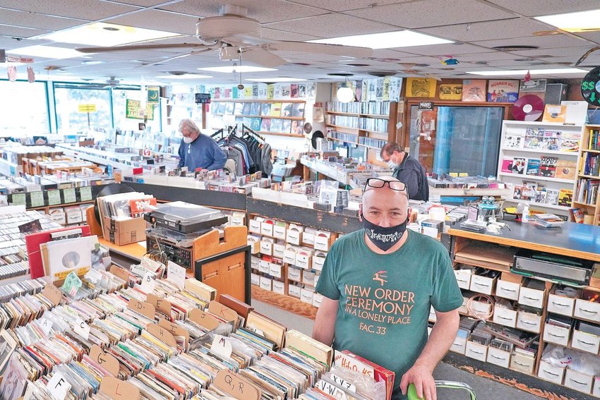 Flat, Black &amp; Circular&rsquo;s Jon Howard stands inside their long-running shop in East Lansing