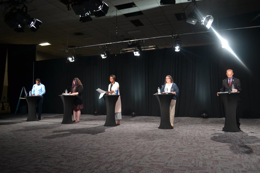 The five candidates at the City Pulse and FOX 47 News mayoral debate. (From left) Farhan Sheikh-Omar, Kathie Dunbar, Patricia Spitzley, Melissa Huber and Andy Schor.
