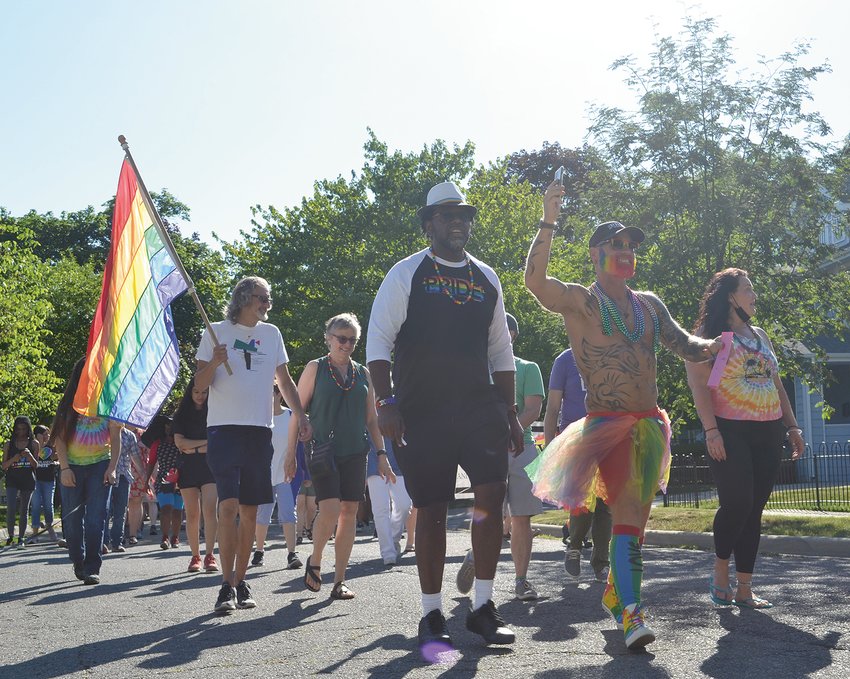 A June LGBTQ pride demonstration makes it way through Lansing&rsquo;s westside neighborhood.