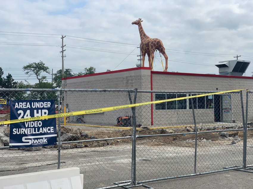 An iconic giraffe statue was returned to the Meijer Express Gas Station on Saginaw Highway this week.