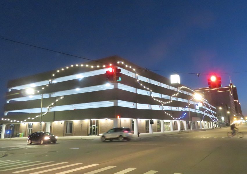 A swooping aluminum ribbon designed by St. Johns artist Ivan Iler was installed on Lansing&rsquo;s Capitol Avenue parking garage this winter. &ldquo;Creativity can come from restraints,&rdquo; Iler said.