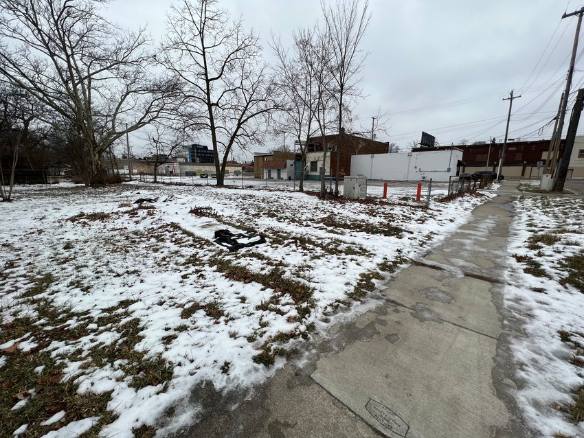 The developer who proposed a parking lot on this property in the Genesee Neighborhood of Lansing  near Saginaw Street says now he'd donate it for a community garden.
