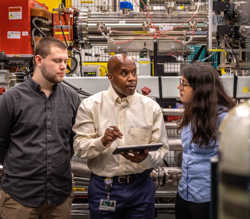 &ldquo;A new machine like this is like a new baby,&rdquo; MSU physics Professor Paul Gu&egrave;ye (center, with two students) said. &ldquo;They don&rsquo;t come with a manual.&rdquo;