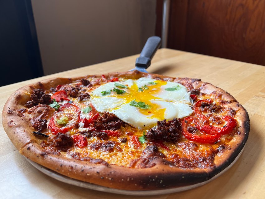 Runny Egg Pizza is a staple at The Cosmos.